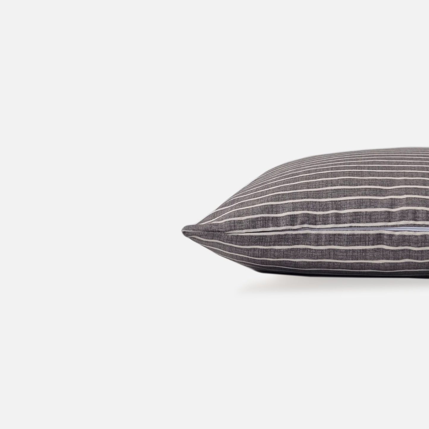 Azure pewter cushion cover side view on a white background