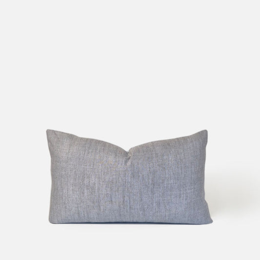 Plain ice blue cushion, front view on a white background