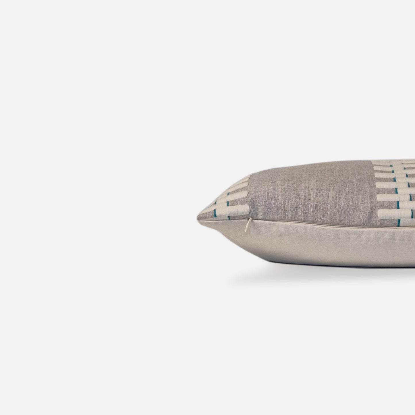 Decorative Threads Neutral Grey coloured cushion, side view on a white background.