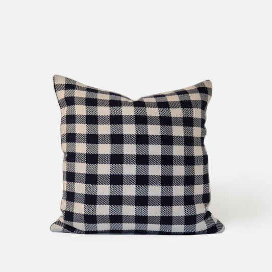 Blue and white checkered cushion, front view on a white background