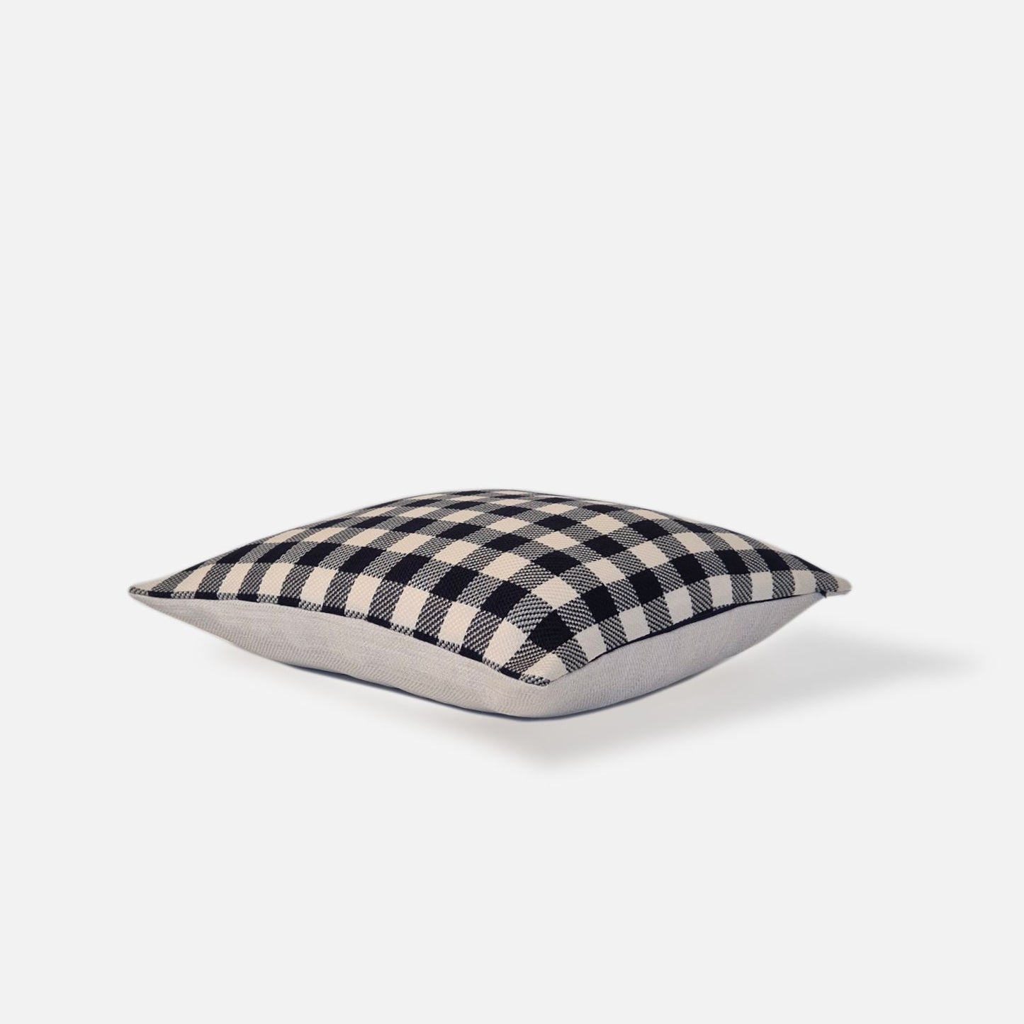 Blue and white checkered cushion, top view on a white background