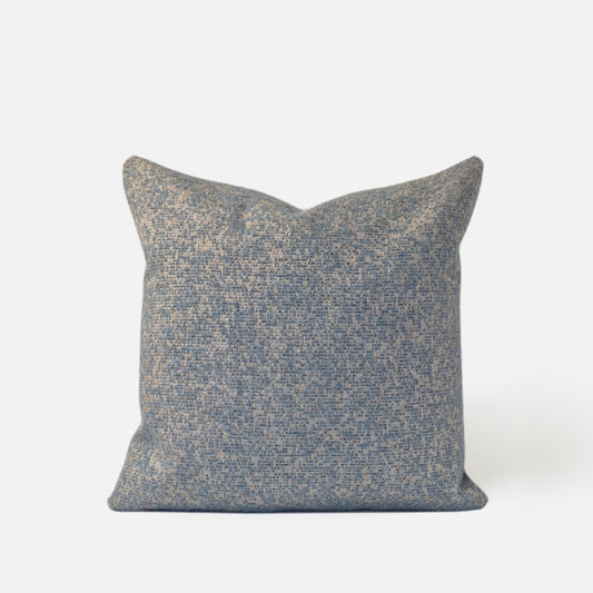 Decorative Threads light blue textured speckled cushion, front view on a white background