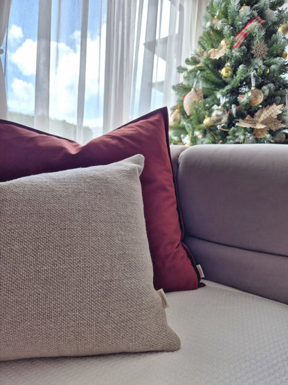 Decorative Threads cushions , Camden Velvet & Linora Line a sofa with a Christmas tree in the background