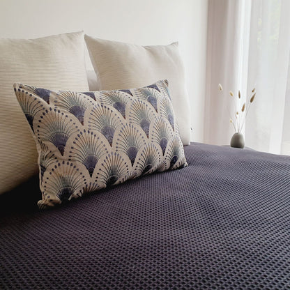 Amelie & Fanciful cushion covers, styled on a bedroom with a black textured duvet