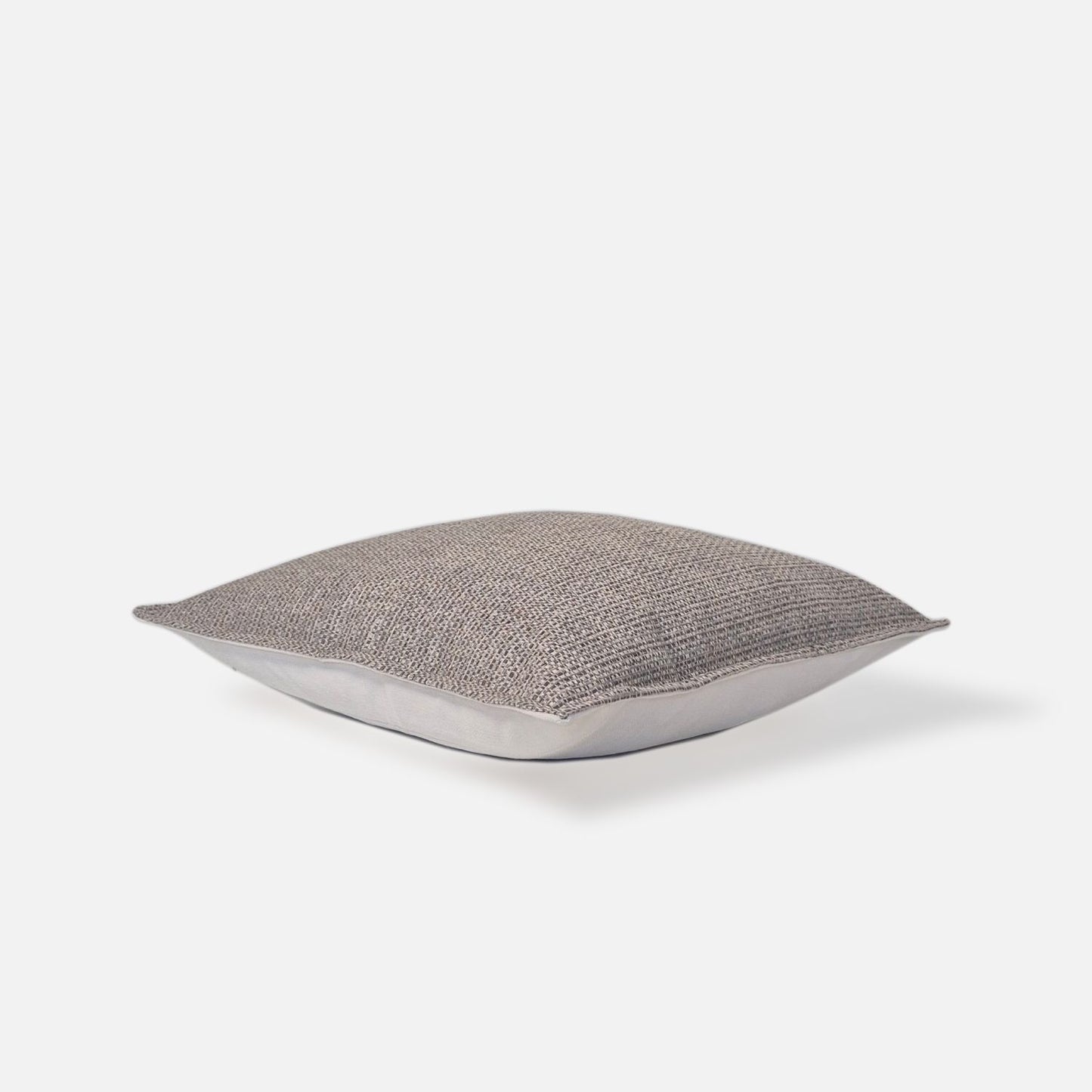 Ashen cushion cover top view on a white background