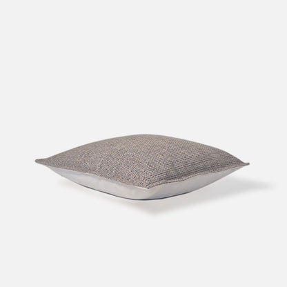 Ashen cushion cover top view on a white background