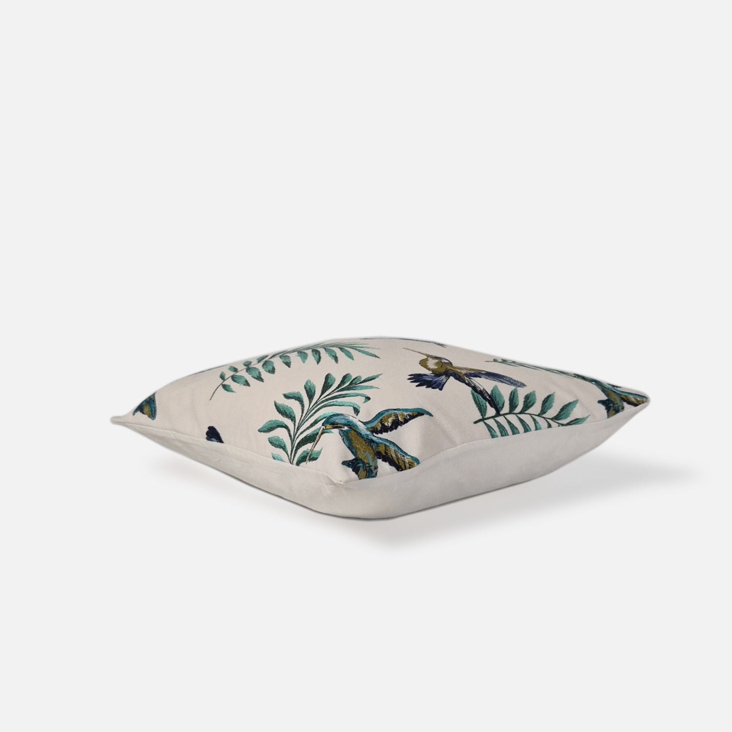 Aerial top-down view of the Avian Ivory Multi-Embroidered cushion cover showcasing the full floral botanical and bird pattern.