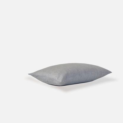 Plain ice blue cushion, top view on a white background