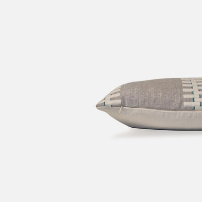 Decorative Threads Neutral Grey coloured cushion, side view on a white background.