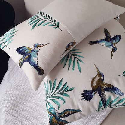 Avian Ivory embroidered cushion styled in a dreamy, sophisticated New Zealand living room setting for a high-end designer look.