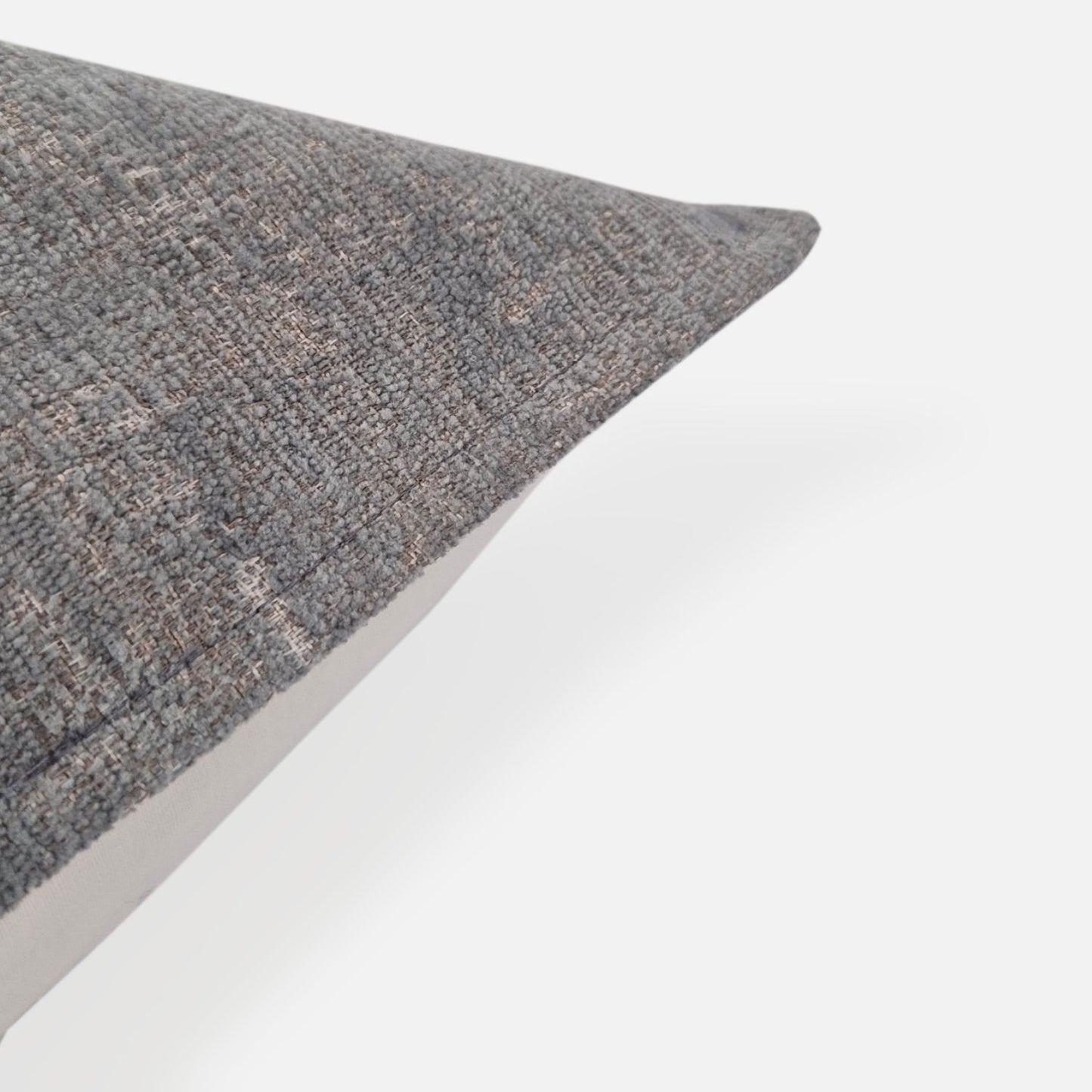 Plain chenille blue green cushion, corner view on a white background