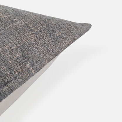 Plain chenille blue green cushion, corner view on a white background