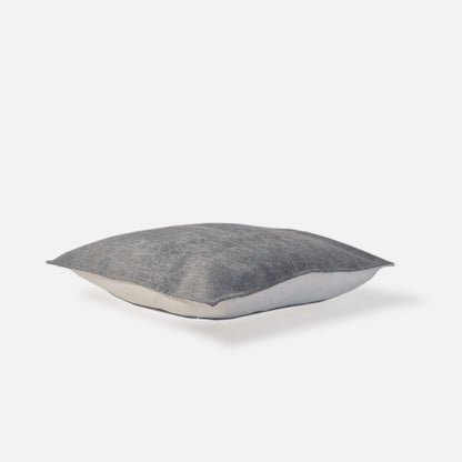 Plain chenille blue green cushion, top view on a white background