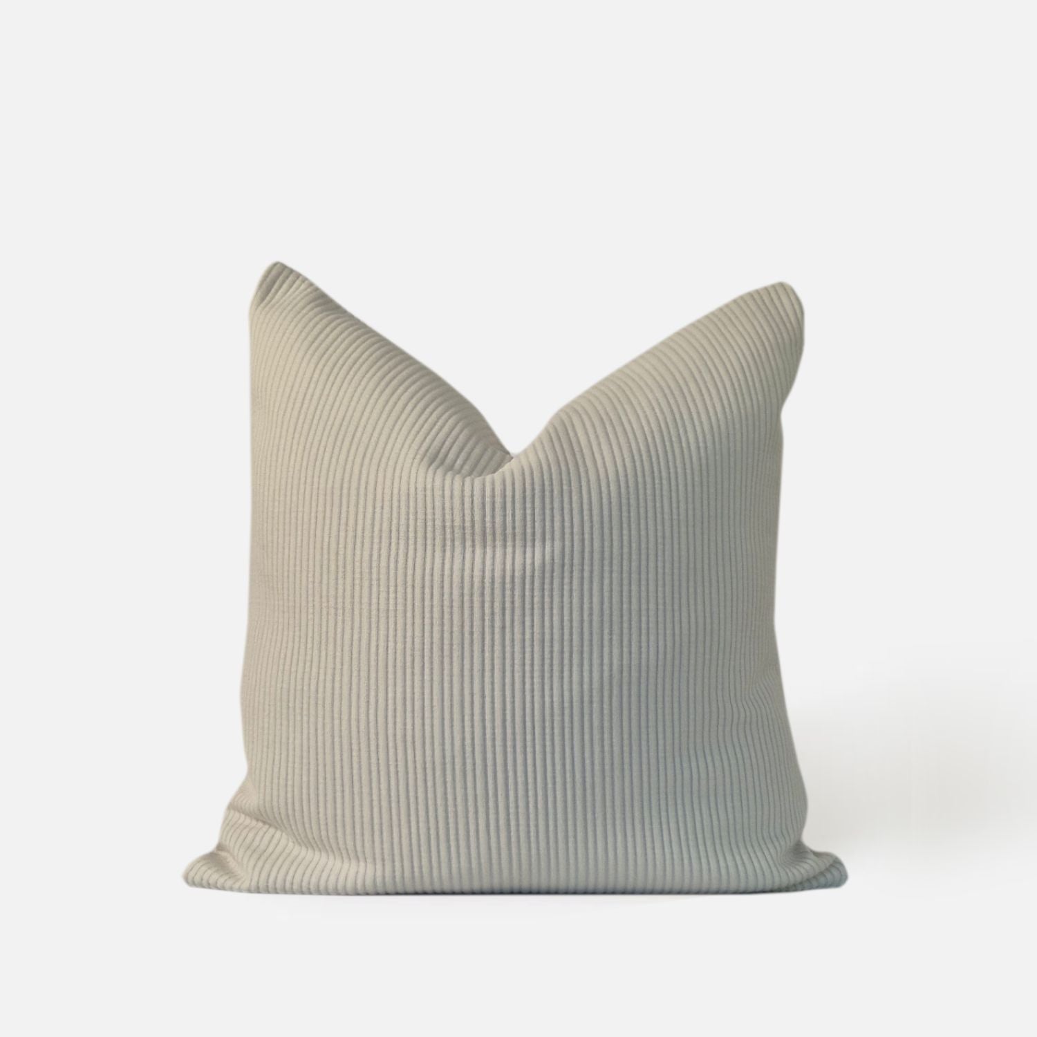 cream textured cushion with ribbed pattern, front view on a white background