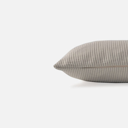 cream textured cushion with ribbed pattern, side view on a white background