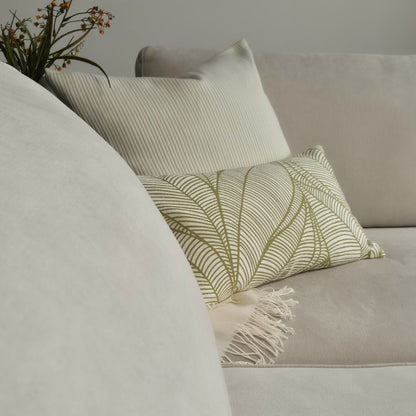 cream textured ribbed cushion with ribbed pattern on a sofa