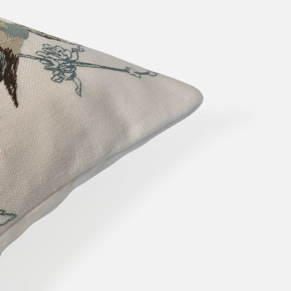 Elysian cushion with bird and plant embroidered pattern, corner view on a white background