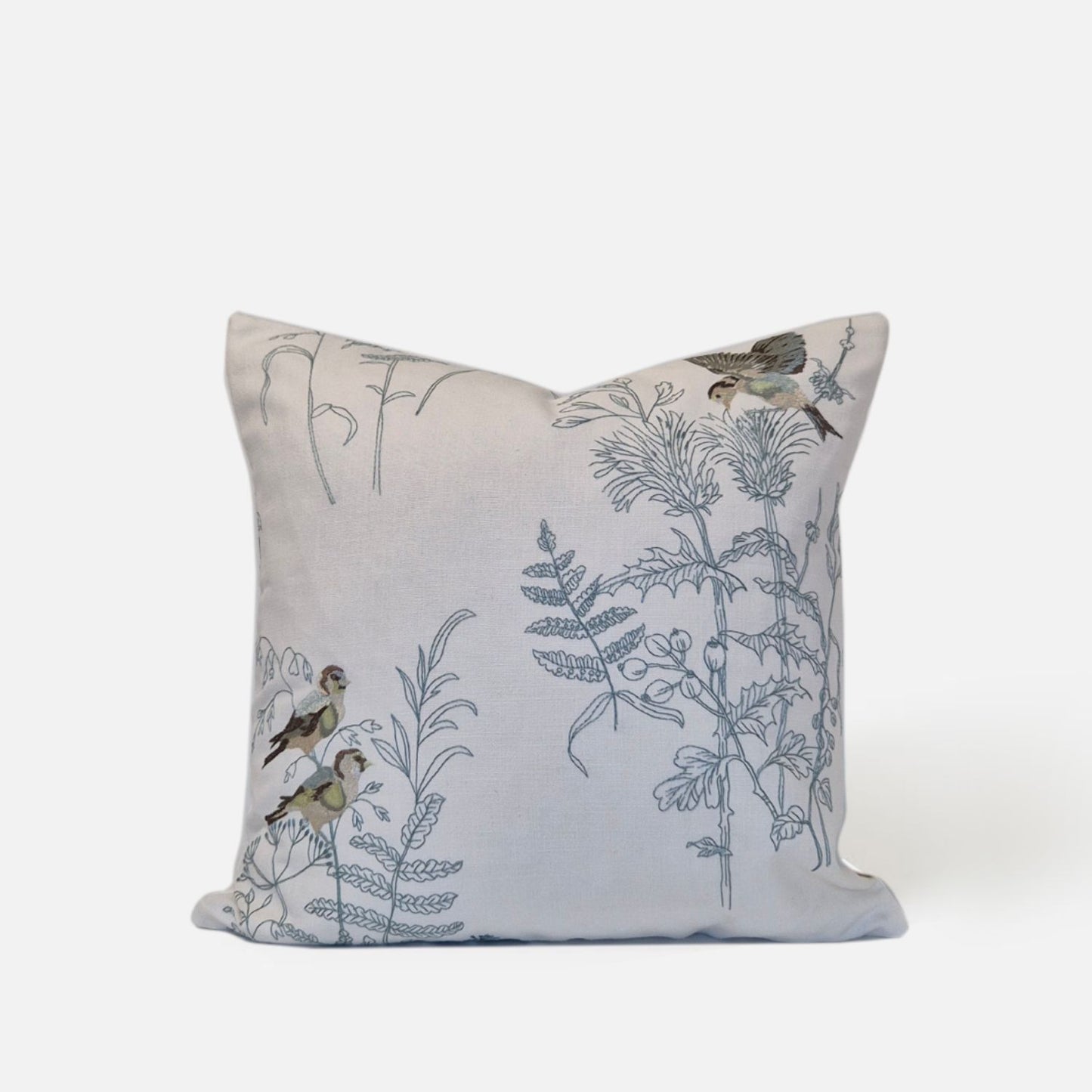 Elysian cushion with bird and plant embroidered pattern on a white background