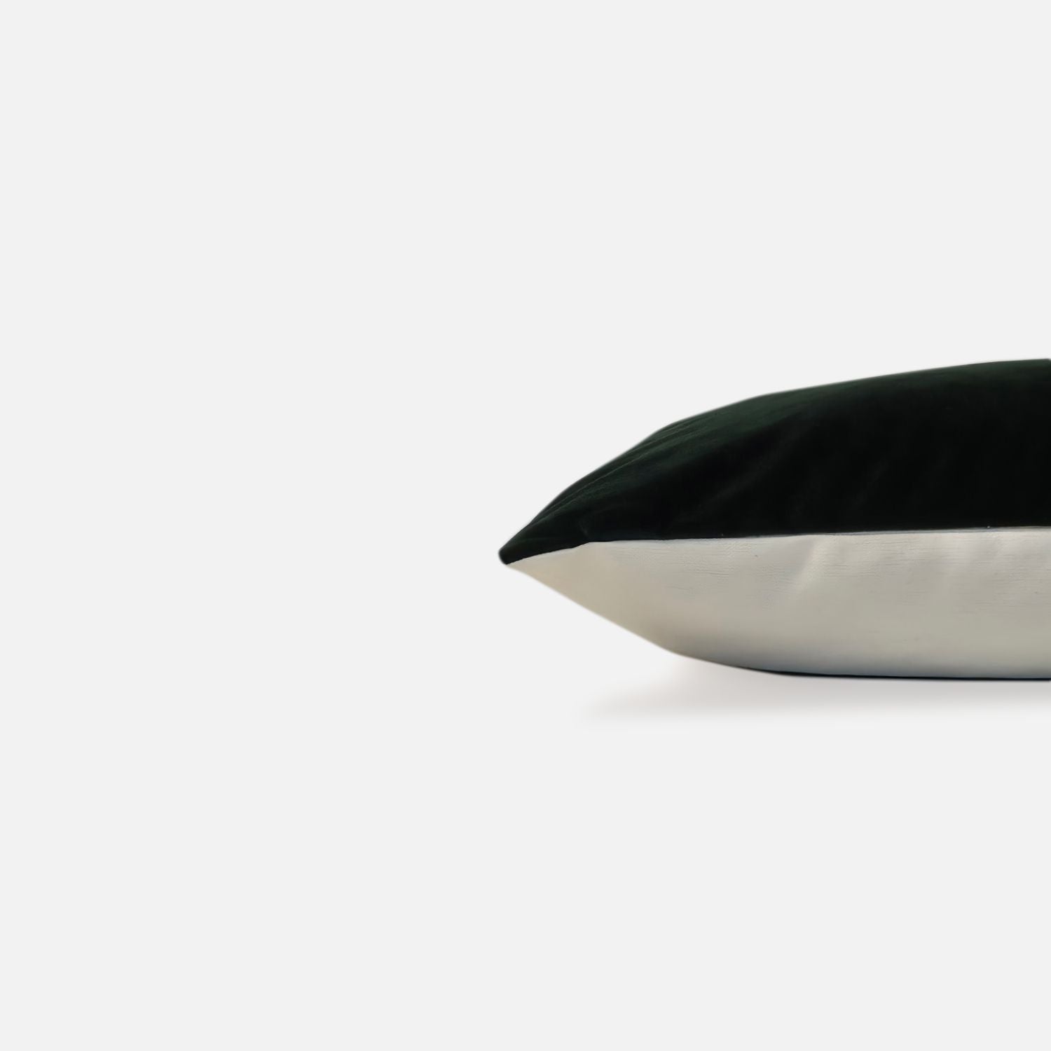 Decorative Threads solid emerald, green velvet cushion cover, side view on a white background. 