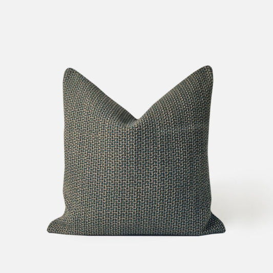 Decorative Threads Multi-Teal Woven cushion cover, front view on a white background. 