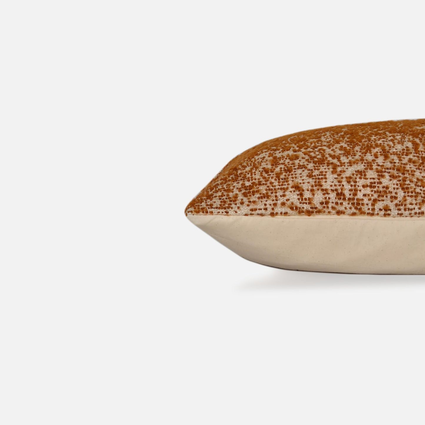 Decorative Threads Ensemble Spice cushion cover combo. Side view of Cinnamon two-tone speckled cushion, on a white background.