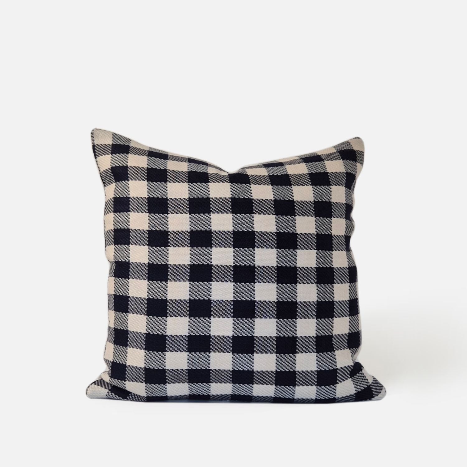 Blue and white checkered cushion, front view on a white background