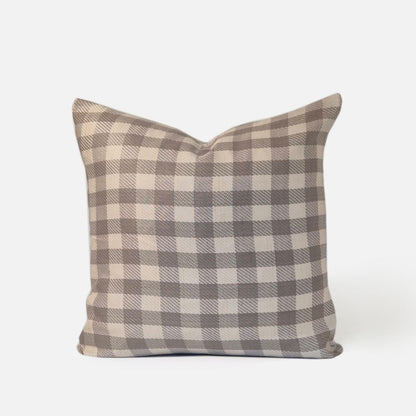 Sand checkered cushion, front view on a white background