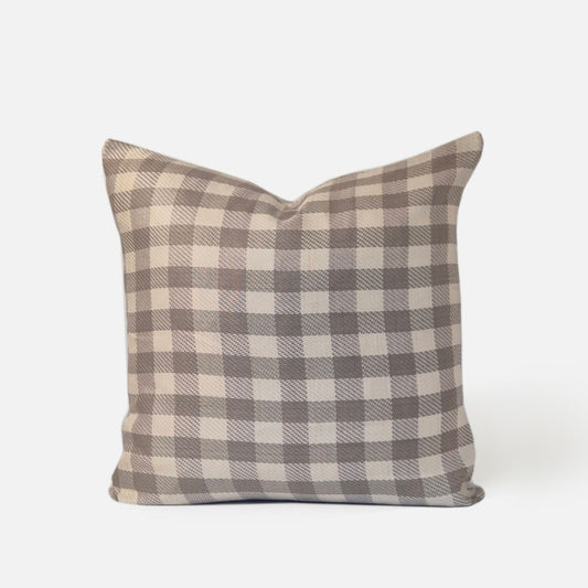 Sand checkered cushion, front view on a white background