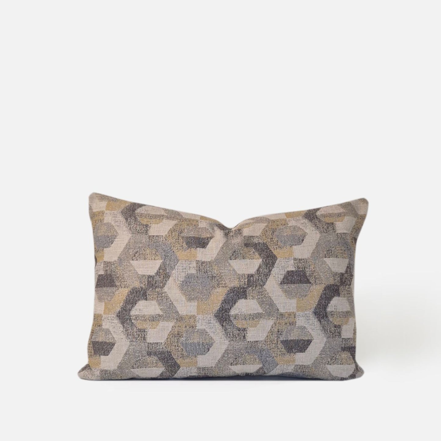 Neutral geometric woven cushion cover with cream, grey and amber tones on a white background.