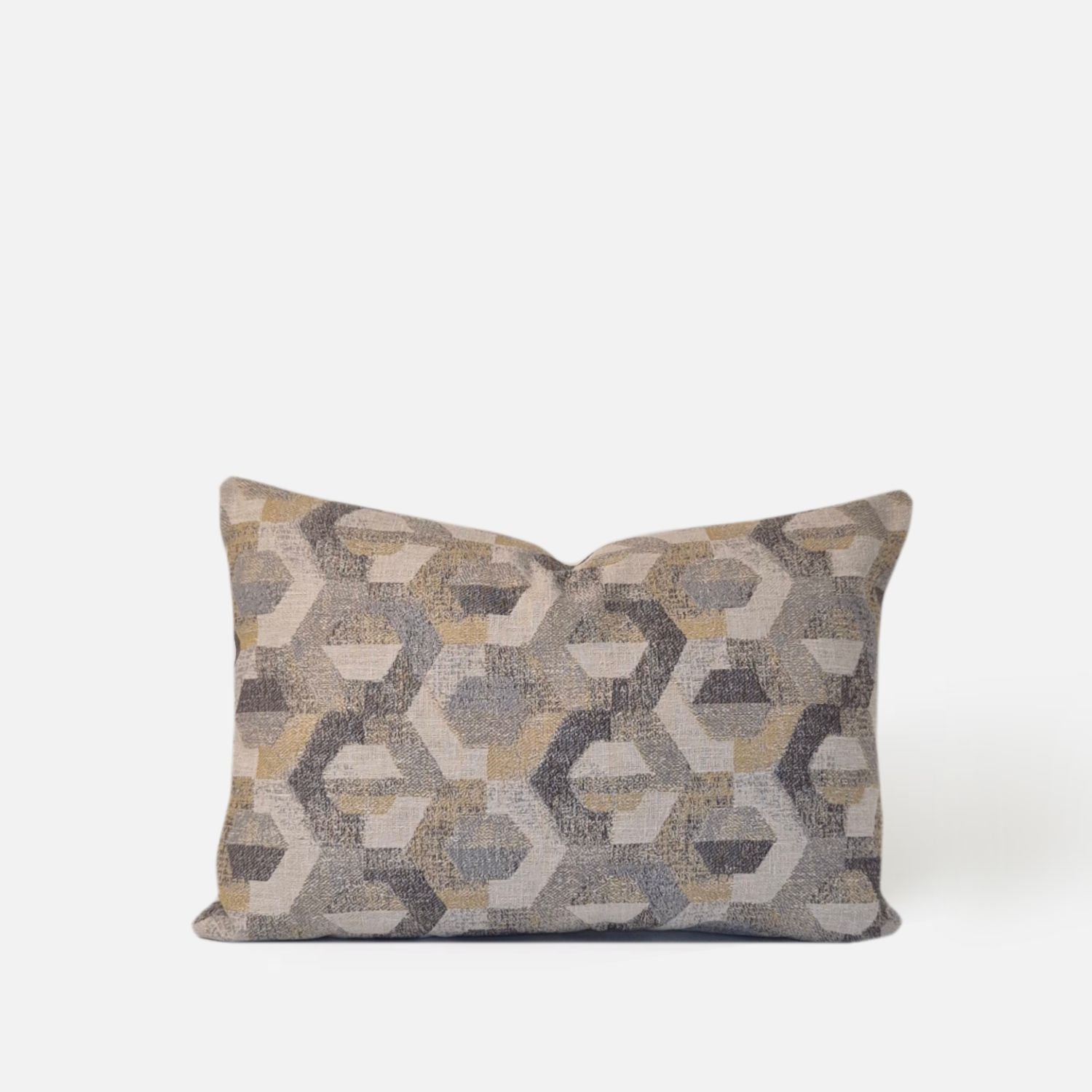 Neutral geometric woven cushion cover with cream, grey and amber tones on a white background.