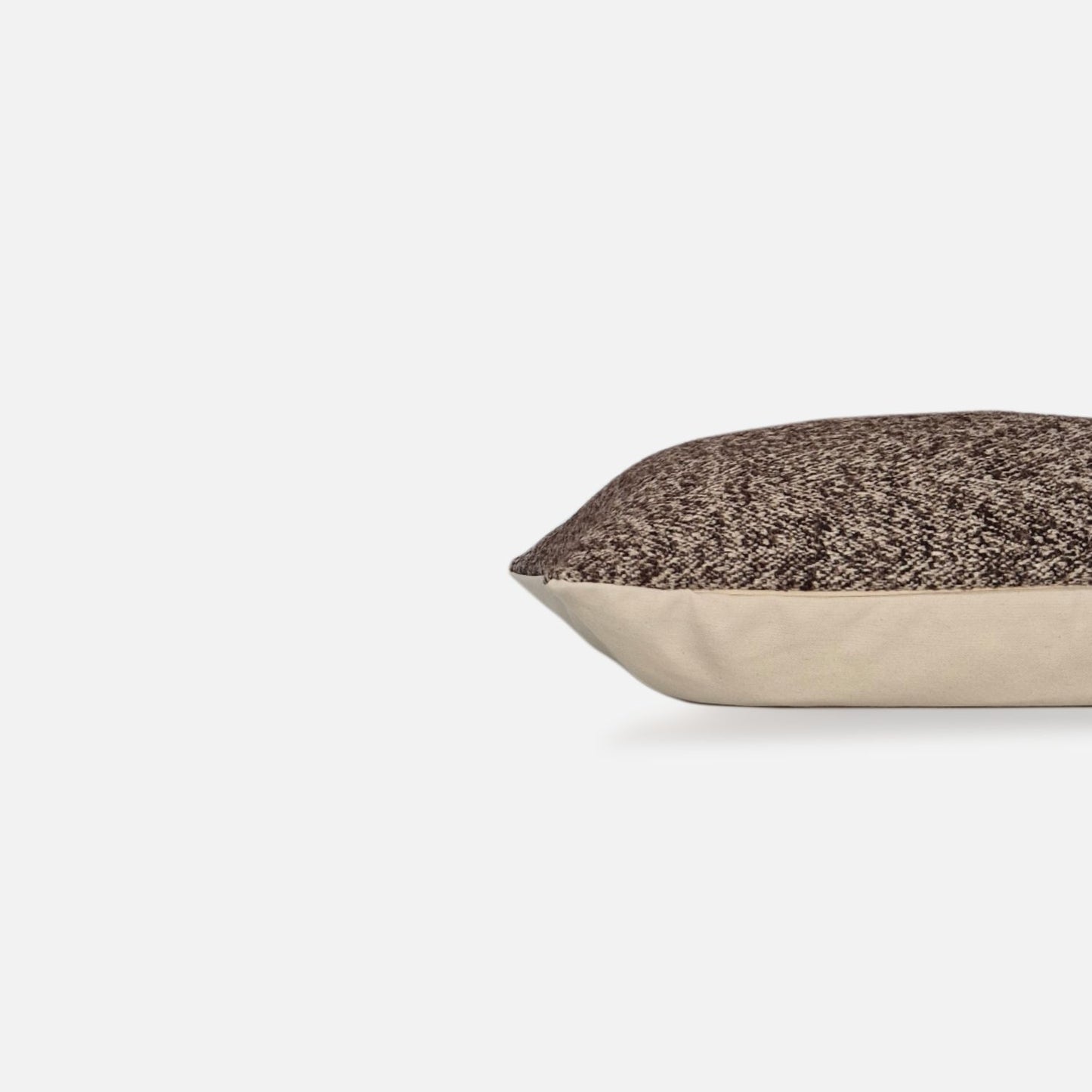 Decorative Threads mocha Cushion, side view on a white background.