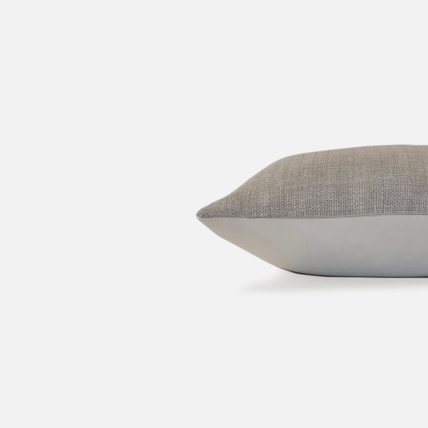 Decorative Threads Natural Sparkle Cushion, side view on a white background.