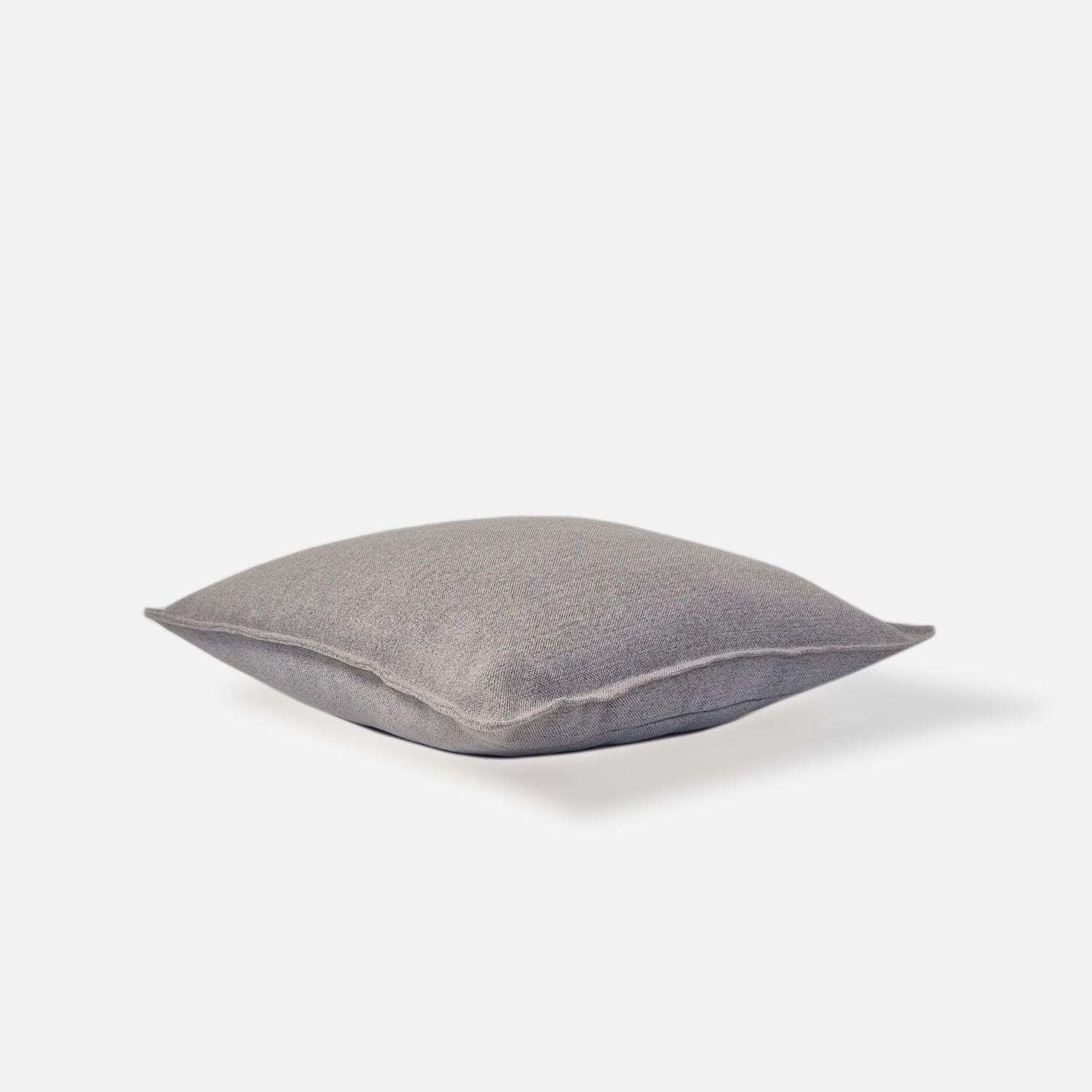 Decorative Threads Hutt grey cushion cover in dove grey with a woven texture, top view on a white background