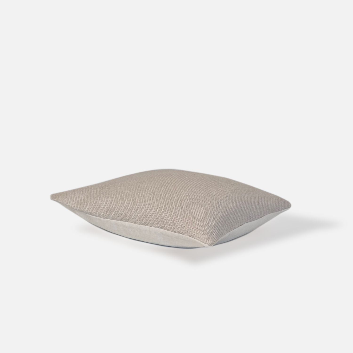 Decorative Thread Ida cushion cover in oatmeal with a woven texture, top view on a white background