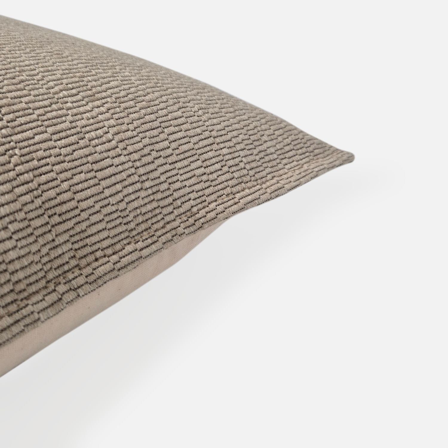 Decorative Threads Katama cushion cover in Brulee with a structured weave pattern, corner view on a white background