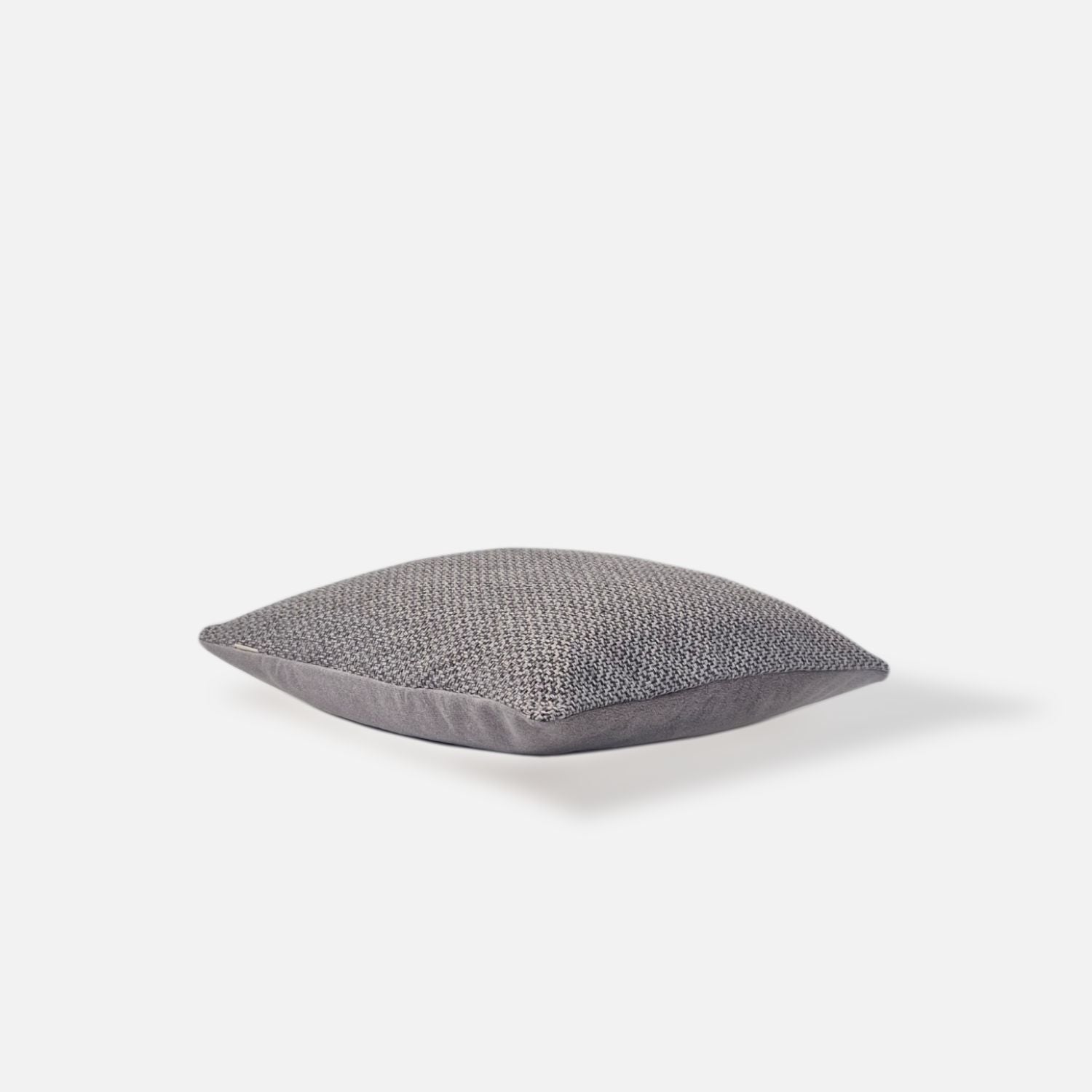 Decorative Threads Larkin cushion cover in Storm with a Pebbled Tweed woven texture, top view on a white background