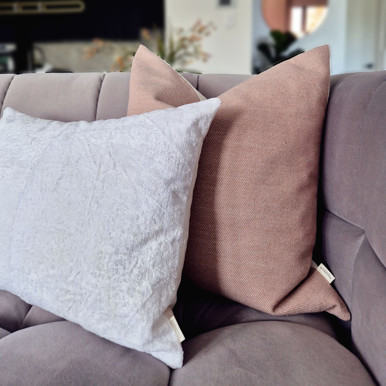  Decorative Threads Natural Harmony cushion cover combo.  Duo of woven and chenille textured neutrals on a grey couch.