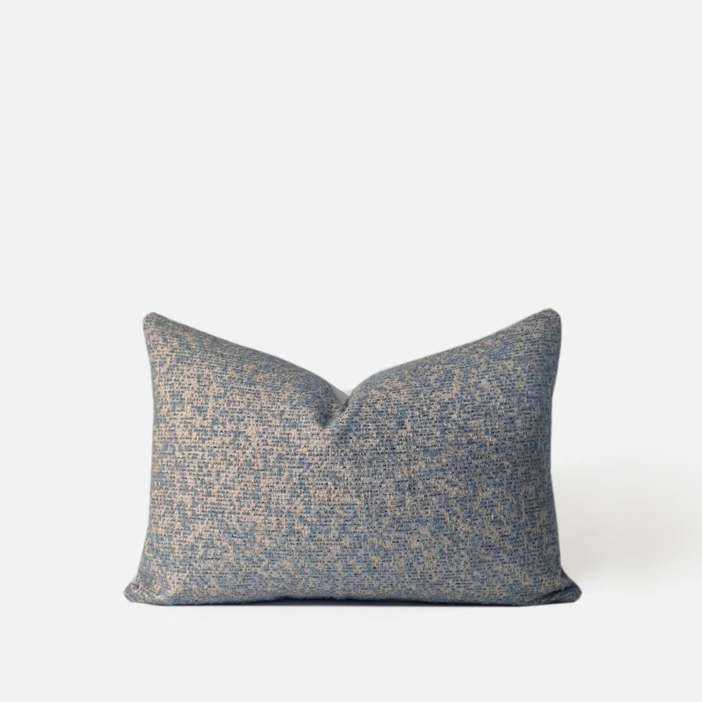 Decorative Threads 50x35cm light blue textured speckled cushion, front view on a white background