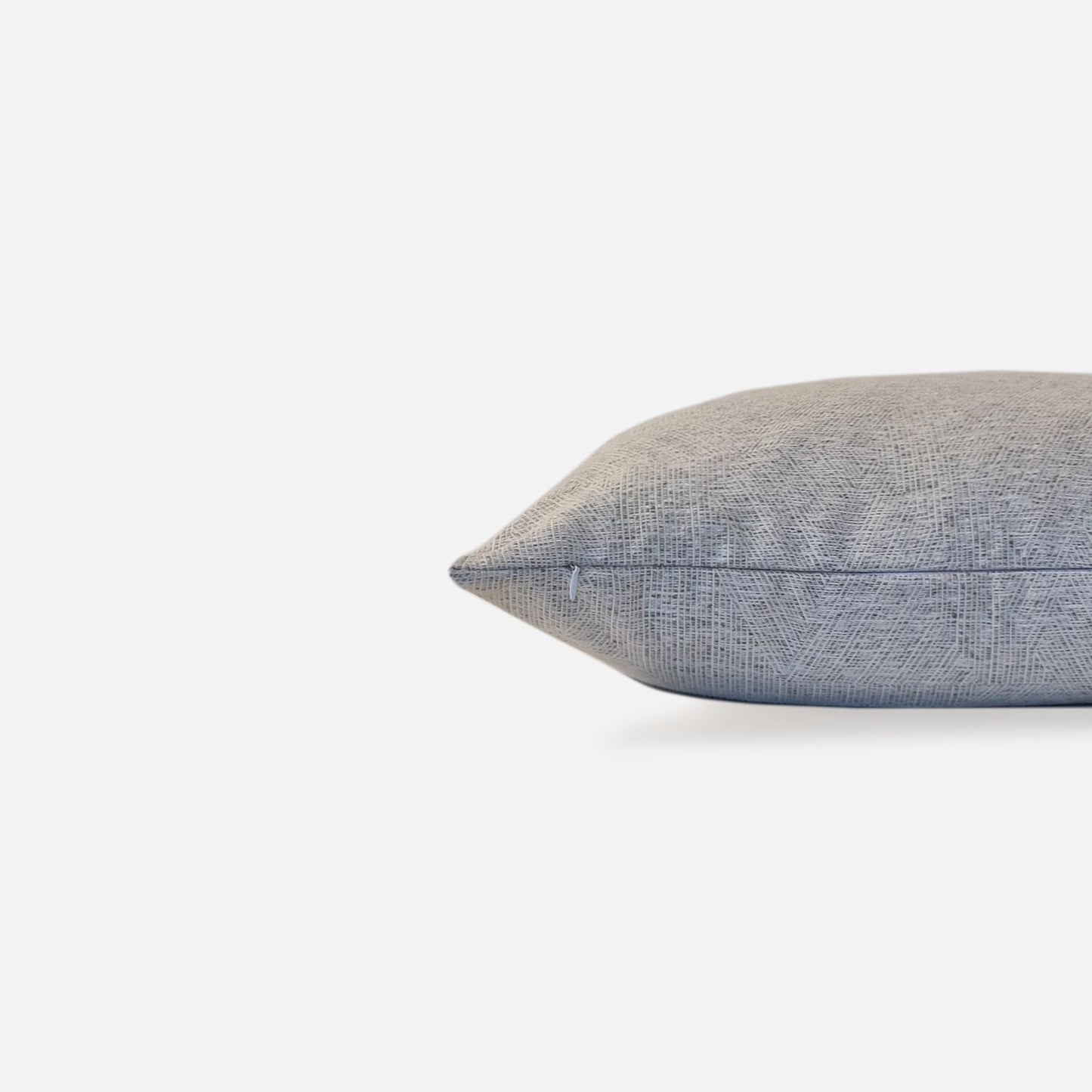 Decorative Threads Rain cushion cover in Grey with a woven texture, side view