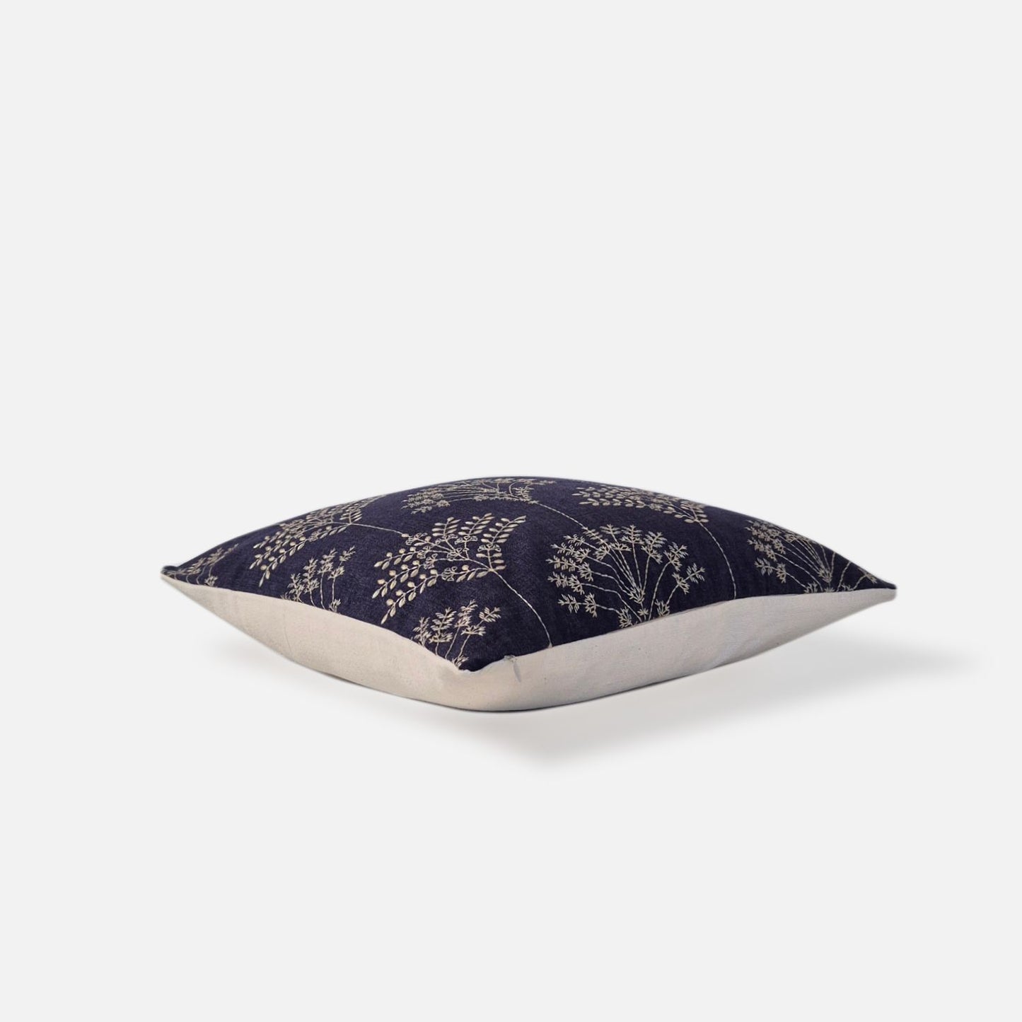 Decorative Threads Regal cushion cover in Midnight Blue/Ivory with an embroidered botanical design, top view on a white background