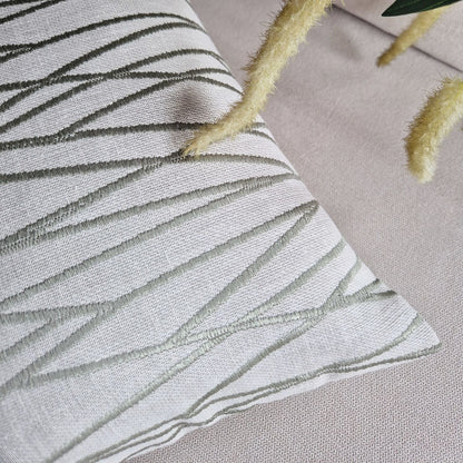 Decorative Threads Meadow textured cushion with leaf pattern on a neutral background.