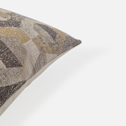 Close-up detail of a textured geometric woven cushion cover in neutral tones.