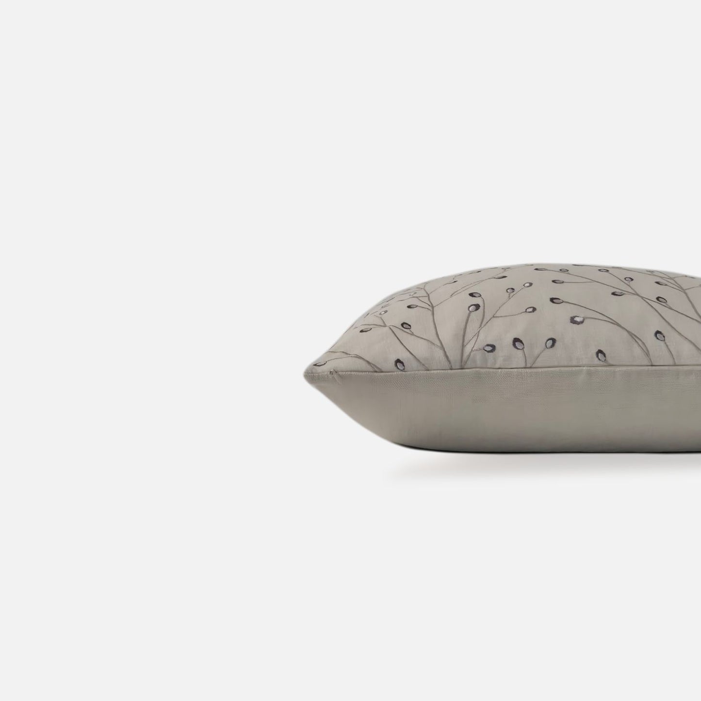 Decorative Threads Twiggy cushion cover in Oatmeal with embroidery, side view