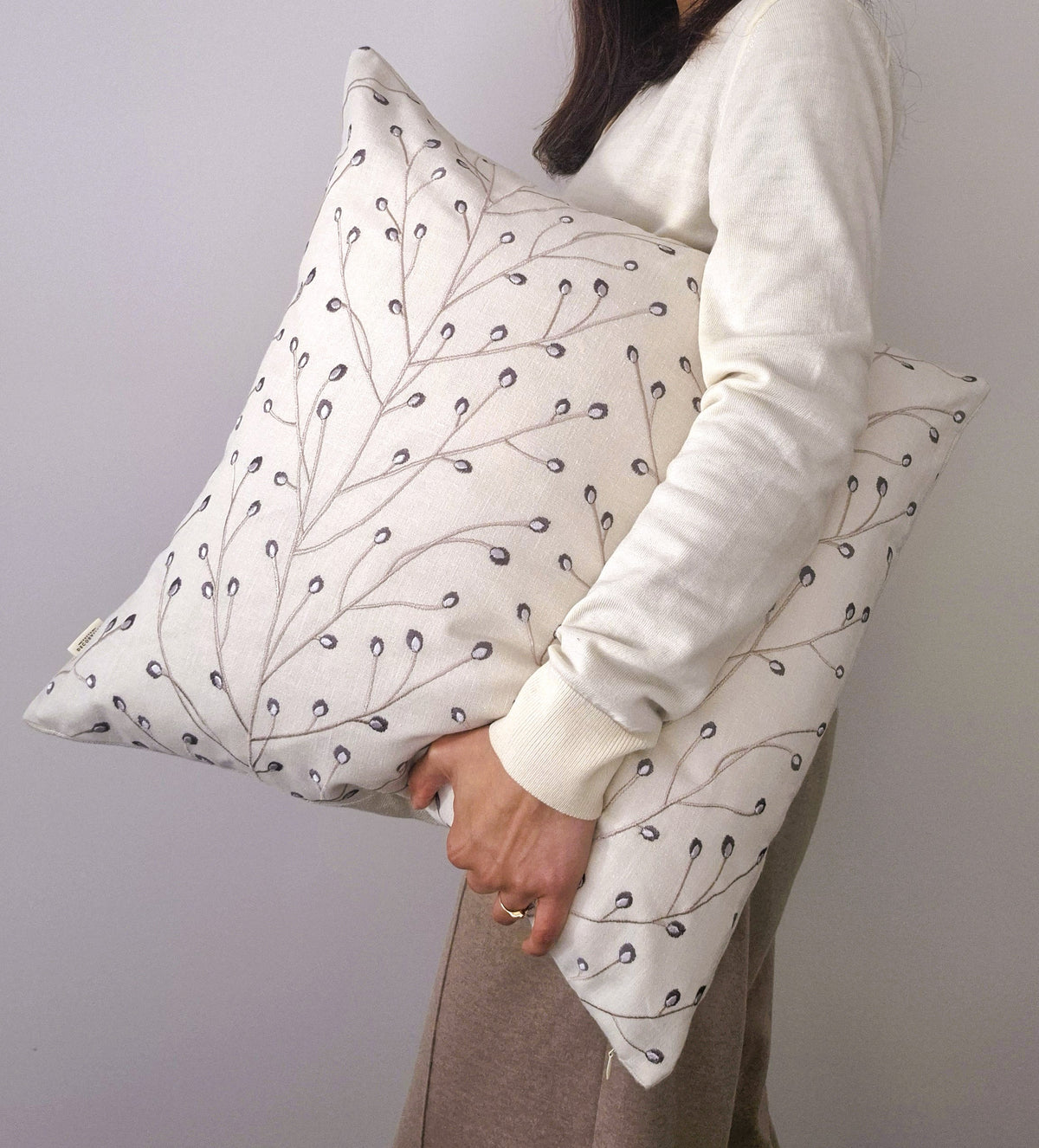 twiggy-embroidered-cushion-cover-neutral-decorative-threads-held-by-founder