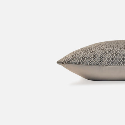 Decorative Threads Textured cushion with a geometric pattern, side view on a white background.