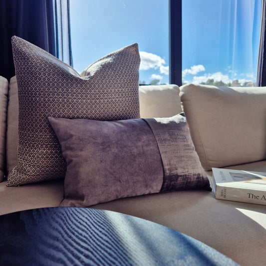 Decorative Threads Urban Edge cushion cover combo on a cream sofa. Velvet and woven grey art of layered luxury.