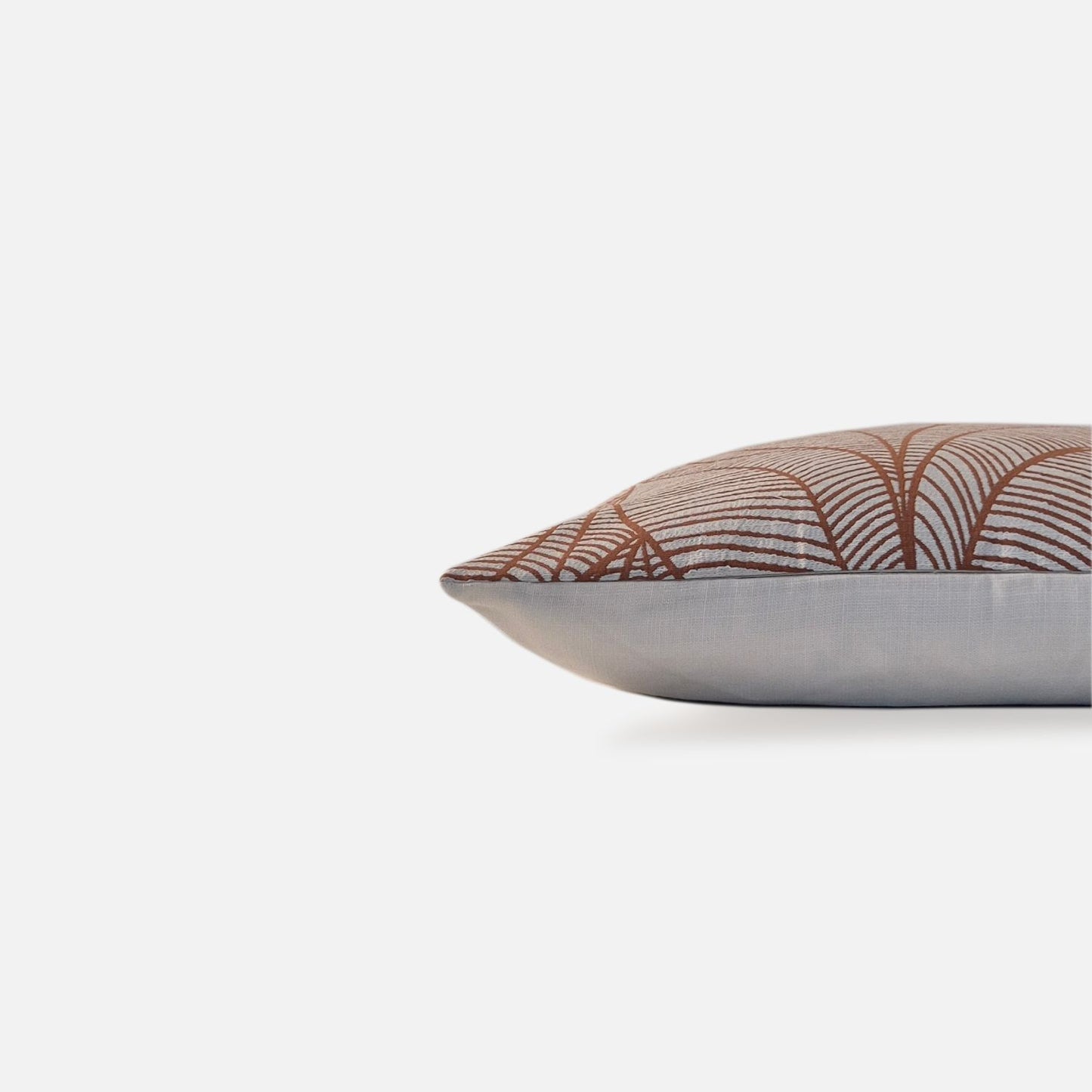 Decorative Threads Veined cushion cover in Pumpkin Spice with a woven botanical leaf pattern, side view